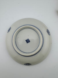 Meiji Imari iroe plate with stylised blossom motif, blue central medallion, and red‑green floral panels – Kotto Living
