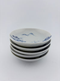 Side view of Meiji imari sometsuke small plate showing curved profile and blue landscape brushwork – Kotto Living